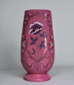 A Victorian French cased glass vase. Pink/white ground, painted foliate design in a stylised border.