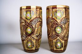 A large pair of Bohemian cranberry cut glass vases. Hand painted foliate sprays and gilded. Height -