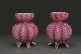 A pair of cased pink footed posy pots. Possibly Stevens & Williams. 