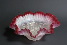 A Victorian cranberry Northwood Poinsettia ruffled bride bowl. 10.5 x 27cm 
