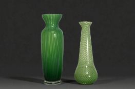 A Victorian green trailed glass vase, together with one similar. Tallest - 20cm