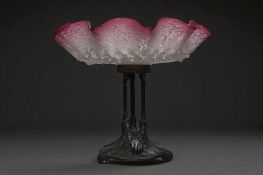 A Victorian Cranberry glass and metal Tazza. Height - 25cm 