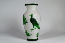 A vintage Chinese Peking glass vase. Green overlay on white ground, with Bird and foliate design.  H
