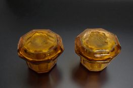 Two Amber glass Cameo boxes. 7 x 8cm 
