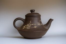 A Chinese Yixing purple clay teapot. Carved  and painted with Cherry blossoms & script to verso. Mar