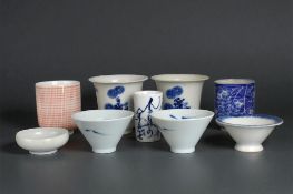 A collection of Japanese and Chinese porcelain cups & bowls. 