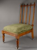 A Regency satin birch rail back side chair. Low level seat, with turned front legs & raised on four 