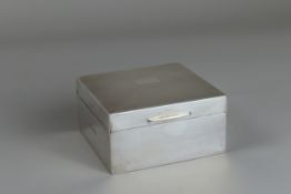 A sterling silver covered box. Wood lined interior, with leather base.Â  Birmingham, 1949 hallmarked