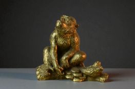 A Japanese cast gilt bronze figure of a Monkey. Seated Monkey on a brach with lingzhi. Height - 7.5c