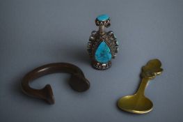 An early 20th century Tibetan white metal and Turquoise snuff bottle, together with a bronze West Af