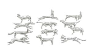 Suite de 12 porte-couteaux animaux en étain fin, Suisse, XXe s., comprenant: chien, renard, chat,...