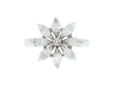 Asprey, bague fleur en platine sertie d'un diamant taille brillant entouré de diamants taille marqui