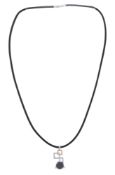 Mouawad, pendentif 2 ors 750 serti d'une hématite facettée rehaussée de diamants taille brillant, su