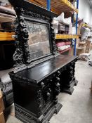 A Victorian Ebonised Oak Sideboard. The Oblong Mirrored Back With An Elaborate Foliate-Carved