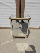 A Two-Drawer Mirrored Nightstand Or Side Cabinet, Featuring A Reflective Glass Surface, Gold-