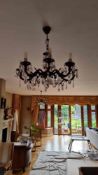 A Czech 8 arm vintage brass and crystal chandelier inspired by Victorian or early 20th-century Fren