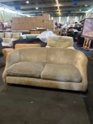 Upholstered sofa features a curved, rounded back and arms that flow seamlessly into the backrest, cr