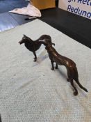 A pair of bronze dogs figurines