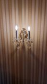 A pair of crystal twin arm wall sconces decorative brass backplate 250 x 220mm