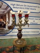 Gothic Revival style candelabra is a striking statement piece. Crafted from patinated bronze, it fea