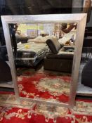 A large contemporary bevelled mirror in silver painted and decorated frame 86 x 118cm