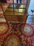 A small, rectangular mahogany table, exhibiting Neoclassical design influences. The flat top