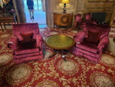 A pair of upholstered armchairs, upholstered in a deep reddish-crushed velvet fabric Each armchair