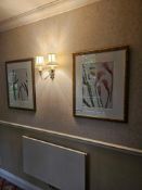 A pair of contemporary botanical prints, each presented under glass with a white mat within a gold-