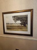 A framed print titled 'Summer Secret' by Megan Lightell, depicting a field with trees under a