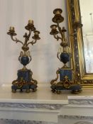 An Empire style three-piece clock garniture in variegated marble and gilt bronze. Comprising a