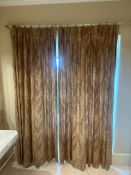 Pair of pinch-pleated paisley drapes on brass-tone pole. This pair of traditional-style drapes is