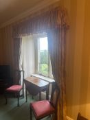 Traditional window drape ensemble with paisley scrollwork motif and tasselled valance. This