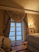 A pair of exceptionally large and opulent window drapes, comprising two full-length curtain panels