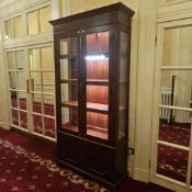 A burl mahogany and glazed cabinet case 105 x 34 x 220cm
