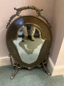 French Louis XV-style brass standing mirror with classical revival motifs. This decorative