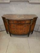 A Neoclassical-style demilune commode, crafted from wood extensively veneered with highly figured