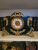 An Ansonia Clock Co. 'Amien' model Rococo Revival mantel clock, circa 1904. The dark cast iron