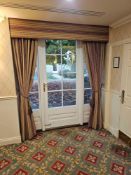 A pair custom-made set of drapes features a fabric pelmet with full-length curtain panels, crafted