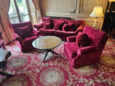 This lot presents two armchairs, accompanied by a circular coffee table. The armchairs are