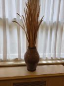 Embossed ceramic vase with dried foliage – mint green – A globular ceramic vase with a deeply