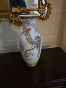 A porcelain vase. The ovoid body features a subtly flared rim and a tapered foot, all covered in a