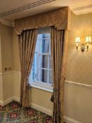 A pair of traditionally styled drapes with a coordinating shaped pelmet and decorative rope tie-