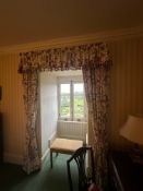 Three pairs of full-length botanical-print drapes with matching valances and tasselled tie-backs.