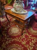 A Queen Anne or Rococo Revival stylistic influenced oak table features a rectangular top and a