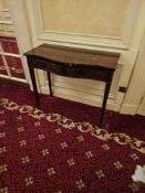 A Federal Style Mahogany Serpentine Front Console Table features a rectangular top with a