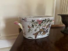 Oval Ceramic Cachepot in Chinoiserie Style An oval-shaped ceramic cachepot or planter, decorated