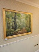 A giclee landscape painting depicting a sunlit forest landscape with a winding dirt path framed