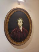 An oval portrait painting, giclee on canvas, depicts a young male sitter from the bust up, dressed