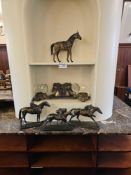 The lot comprises a collection of equestrian-themed decorative objects. The collection includes a