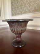 A Neoclassical style patinated brass pedestal vessel. Likely intended as a small urn or footed bowl,